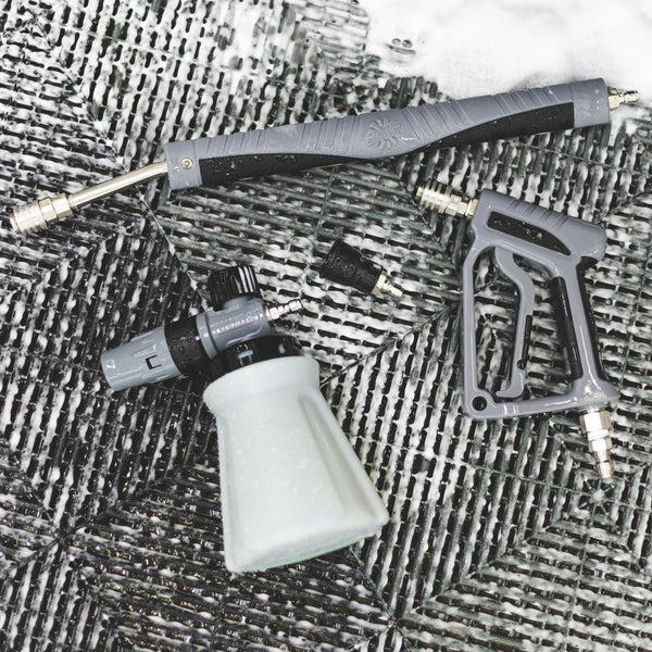 Ultra H2O Spray Gun, Foam Cannon, Spray Wand and nozzle laid out on a wash mat